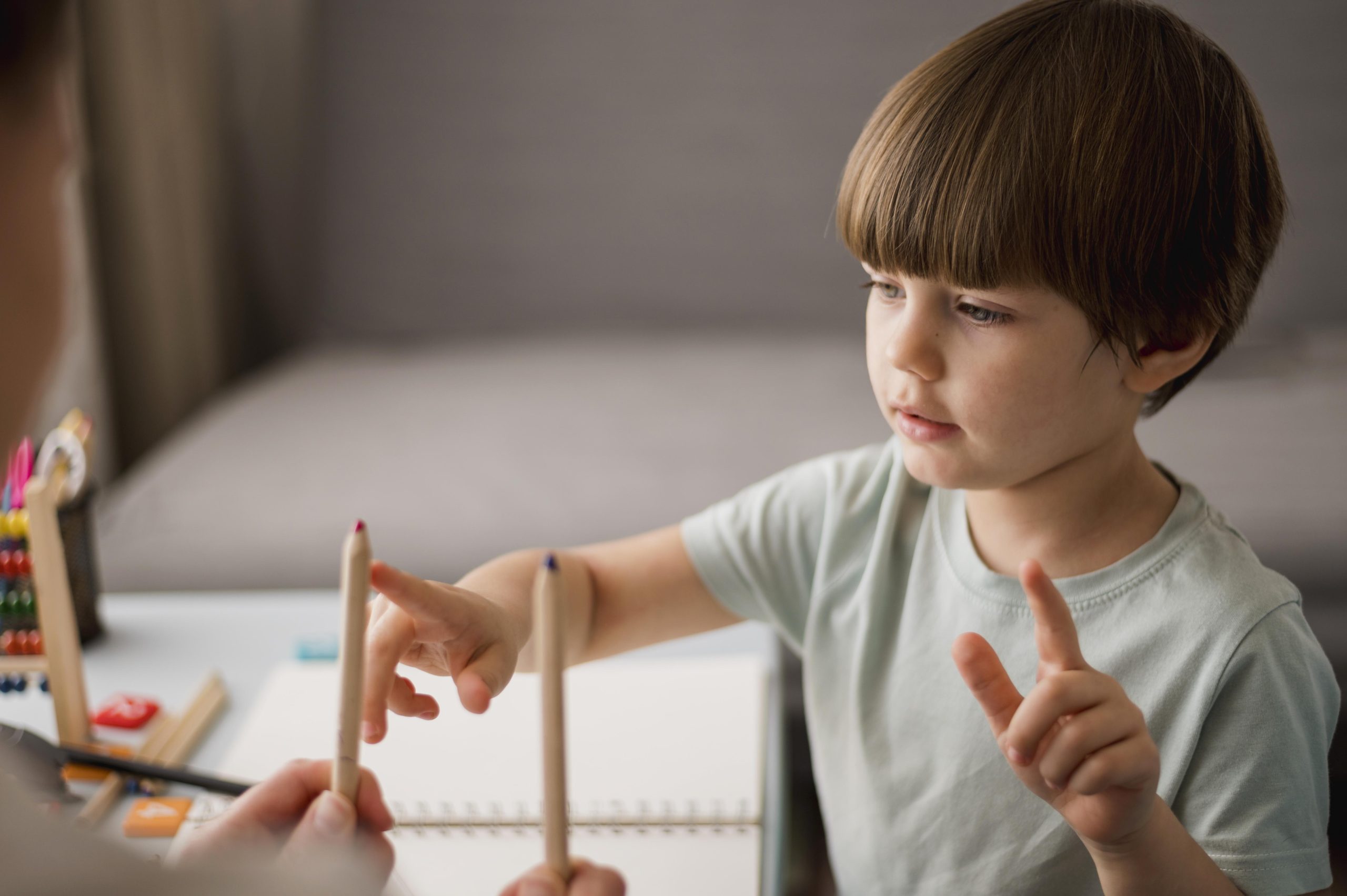 side view child learning how count home using pencils scaled